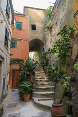 Fototapeta na wymiar Ancien house with steps and arch in the village of Vernazza. Cinque Terre, Liguria, italy