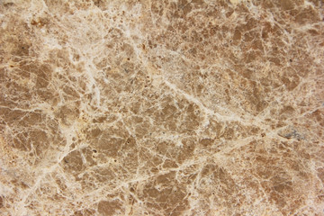 Fototapeta premium brown stone or mwith cracks and patternsarble wall a texture
