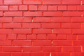Fototapeta na wymiar Brick wall painted red. Texture. Background.
