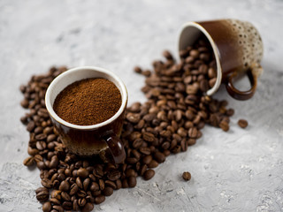 Coffee Cup with freshly ground coffee and natural coffee beans