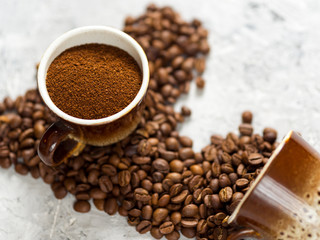 Coffee Cup with freshly ground coffee and natural coffee beans