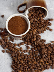 Coffee Cup with freshly ground coffee and natural coffee beans