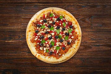 Mozzarella pizza; on wooden table; top view; copy space; pizza; italian food; mozzarella;