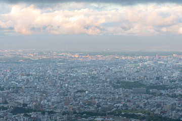 Naklejka na ściany i meble Sapporo city skyline view from Mount Moiwa. Sapporo, Hokkaido, Japan