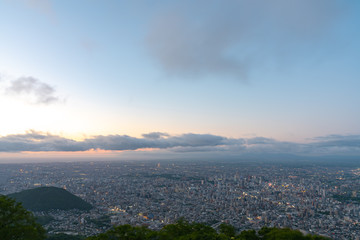Night cityscape view of Sapporo city from Mountain Moiwa observation. The most popular tourist destinations viewpoint for tourism. Sapporo, Hokkaido, Japan.
