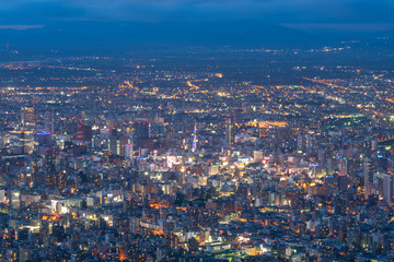 Night cityscape view of Sapporo city from Mountain Moiwa observation. The most popular tourist destinations viewpoint for tourism. Sapporo, Hokkaido, Japan.