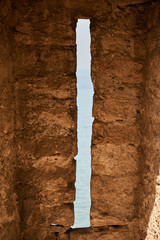 View from the old window - stone frame of landscape. Window in an old stone fortress. Nice weather