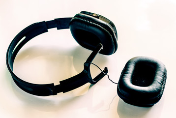 broken headphone, detachable headphones at work. concept of bad quality  listening earphones with copyspace  - image 