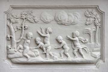 bas-relief on a base at the garden of the lower belvedere in Vienna (Austria)