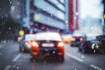 blurred transport background snow / traffic on a winter highway, seasonal auto concept, blurry auto texture, traffic jams