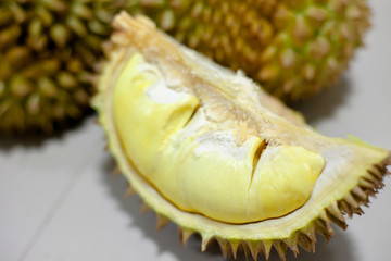 Hand peeling durian shell by knife. The durian is a king of fruit and Recommended Menu in Thailand .