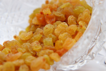 Sweet yellow raisins in a crystal vase.