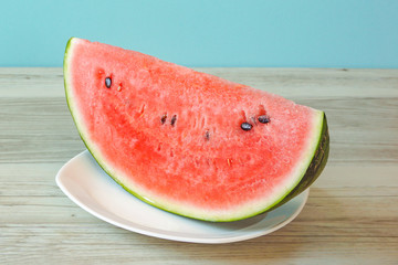 Watermelon on the table. Watermelon on a plate. テーブルの上のスイカ。皿の上のスイカ