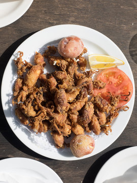 Fried chopitos, typical dish of Spanish food. Chopitos de lanzarote with crumpled potatoes