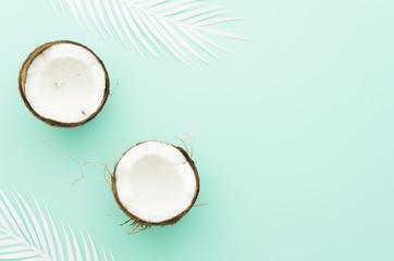 Coconuts with palm leaves on table