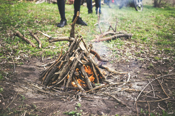 Bonfire and bikes in the background. The concept of a healthy lifestyle and leisure with a bicycle.