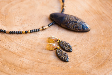 Turkish style jewelry design handmade. Black and gols earrings and necklace bohemian.