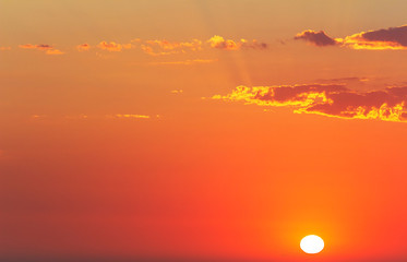 beautiful red sunset and bright sun on the horizon