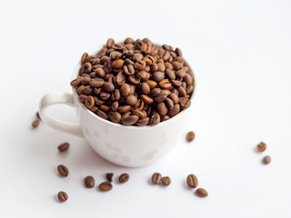 Coffee beans in white cup isolated on white background, drinks concept