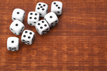 Dice on wooden table. Background for casino games.