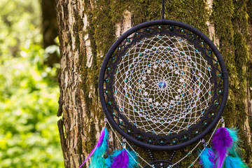 Handmade dream catcher with feathers threads and beads rope hanging