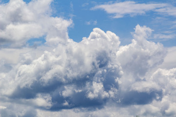 Naklejka na ściany i meble white Cumulus clouds against blue sky