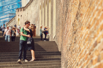 young couple in love walking on a city street . sightseeing traveler. Prague, Czech Republic