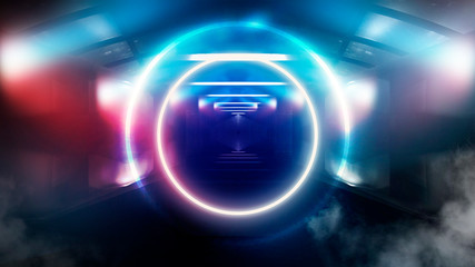 Neon circle, wet asphalt, reflection. Neon circle with the center of a dark empty scene with spotlights. Abstract light. Lights of the night city, abstract light, smog, smoke.