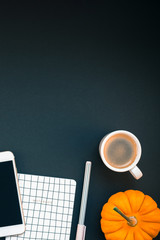 Table with mobile phone and coffee cup