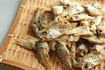 Dried fishes on bamboo sieve 