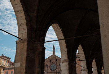 view if the Church of St. Francesco from covered walkway in a sunny day. Piacenza. Emilia-Romagna