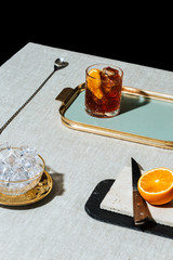 Negroni, an Iba cocktail, with 1/3 gin, 1/3 bitter, 1/3 vermut, in luxury pop style, rich and...
