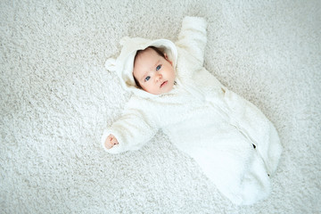 infant in overalls