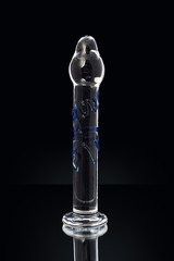 Clear colored Butt plug made of glass on a black background