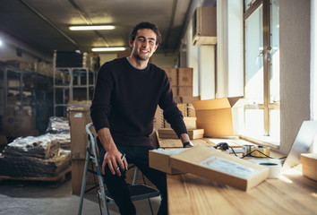 Small business owner at his work desk