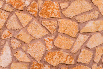 Old natural stone wall, photo texture seamless background
