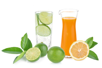Orange juice glass and Full glass of fresh cool tonic with lime fruits isolated on white background