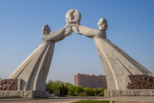 Arch of Reunification in pyongyang, north korea. the translation of the korean characters is "three-point charter"