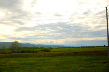 Green field in Spring with Mountain view