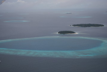 Fototapeta na wymiar Small islands in the Indian ocean from the plane