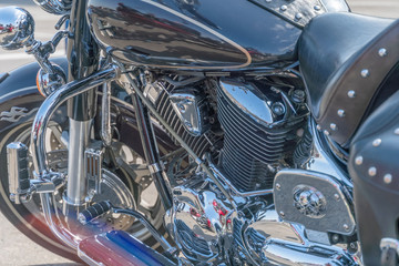 Close up view of a shiny motorcycle engine. Chrome motorcycle engine close up