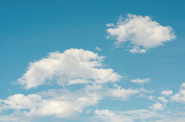 Naklejka na ściany i meble Blue sky and white clouds with blurred pattern background