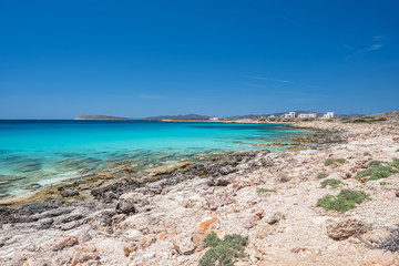 Rocky beach with amazing tranquil water on Paros island, Greece.