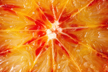 Close up macro of fresh organic Sicilian blood oranges sliced.