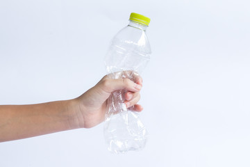 hand holding plastic bottles for recycling to conserve the environment.