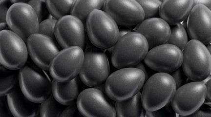 Blank black egg stack mock up, depth of field, 3d rendering. Empty heap of fairytale dragon eggs mockup. Clear pile of boiled product for tale decor template.