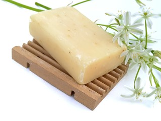 Natural soap with flowers of a poultry cage on an isolated background