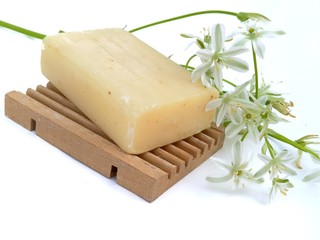 Natural soap with flowers of a poultry cage on an isolated background
