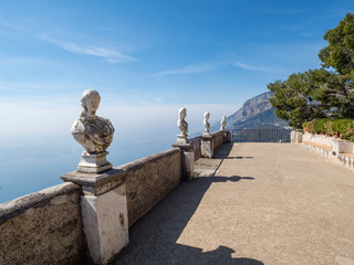 April, 2019: White statues decorate a Terrace of Infinity in Villa Cimbrone above the sea in Ravello, Amalfi Coast, Italy.