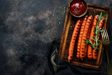 Traditional bavarian sausage with ketchup. Top view with copy space.